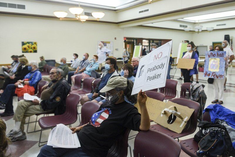 Power plant session draws protesters